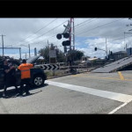 tow truck blocking train tracks